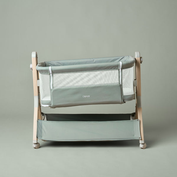 OBaby Cloud Bedside Crib Bundle Including Fitted Sheets – Sage displayed with fitted sheets.