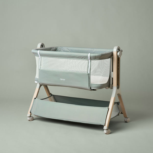 OBaby Cloud Bedside Crib Bundle Including Fitted Sheets – Sage on a light background.