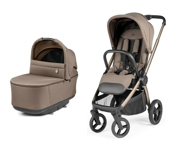 Beige and black peg perego city loop pro stroller with matching carrycot and sleek metallic frame pine bark color