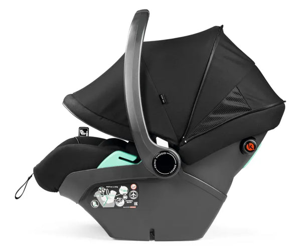Black and teal Peg Perego City Loop Pro infant car seat with padded canopy and adjustable harness for secure travel