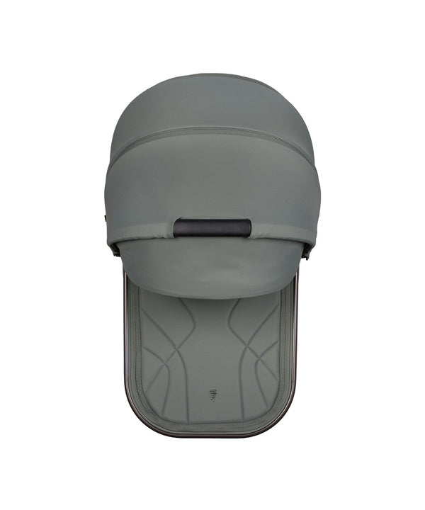 Gray fabric covered stroller canopy with black handle and stitched detailing on venicci upline 3 travel system in aloe