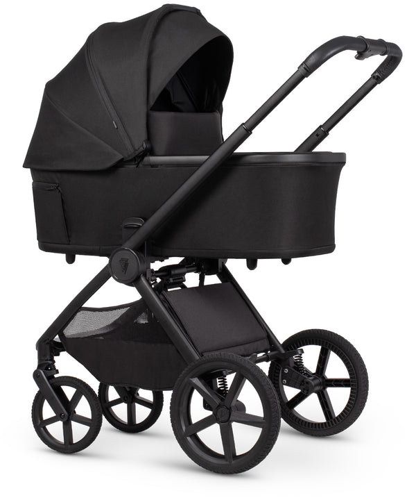 Venicci upline 3 travel system black baby stroller with sleek modern design and matte finish shown from the back side