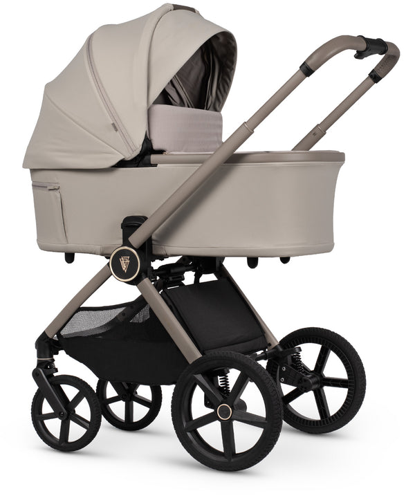 Beige fabric-lined venicci upline 3 travel system pram with black wheels and frame in sleek modern design