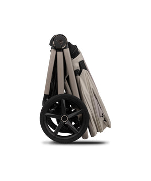 Venicci Upline 3 travel system in pebble beige and black foldable stroller with sleek design and large front wheel