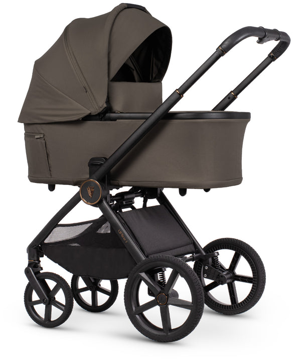 Venicci Upline 3 travel system in truffle with modern olive-green pram featuring black metal frame and storage basket