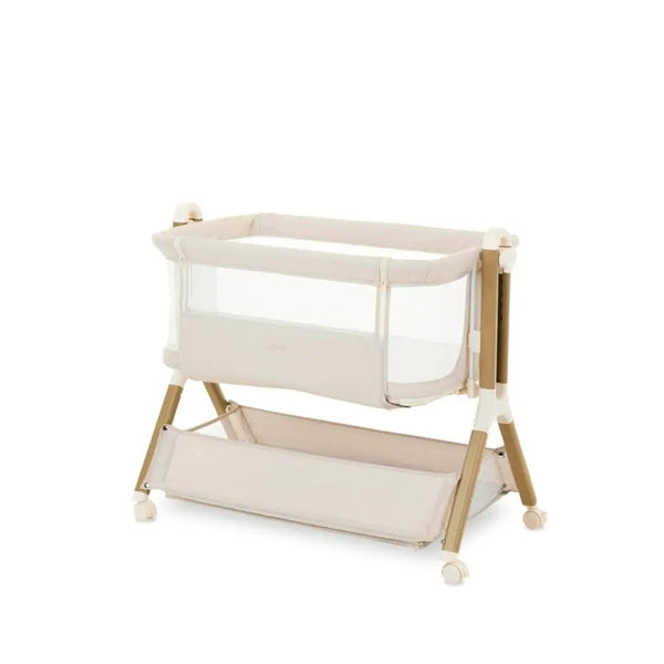 OBaby Cloud Bedside Crib Bundle Including Fitted Sheets – Oatmeal with beige fabric and wooden legs.