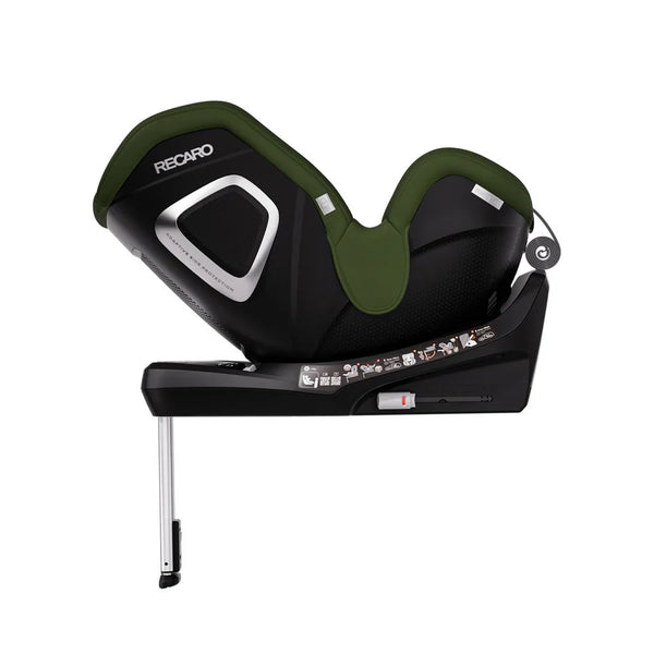 Epic Green TORON 1 KID, reclined rear-facing side view showing silver-trimmed shell and extended support leg.