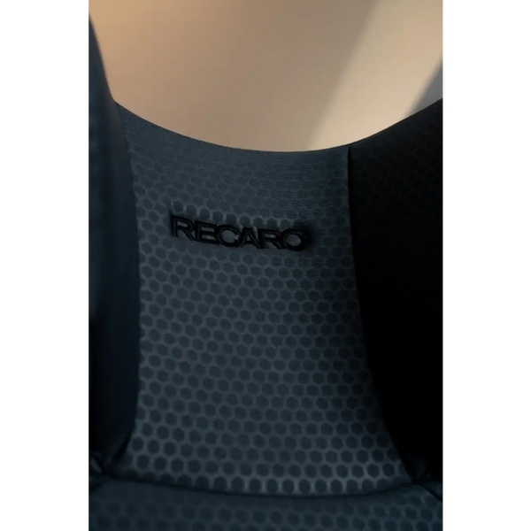 Close-up of the Gallant Grey headrest’s honeycomb-patterned fabric and black Recaro logo