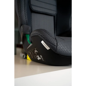 Close-up of the Gallant Grey seat cushion and black base, showing the AXION 1 label and green lap belt guide.