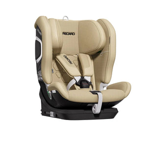 Recaro VELIX 1 in Elegant Beige, angled front view showing padded harness, central buckle and contrast stitching