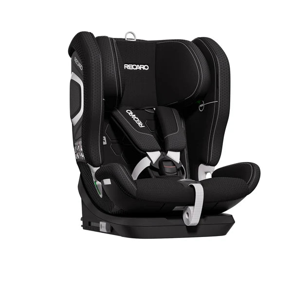 Recaro VELIX 1 in Fresh Black, angled front view showing padded harness, central buckle and contrast stitching.