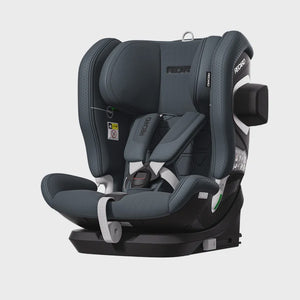 Recaro VELIX 1 in Gallant Grey, angled front view with padded harness, black base and outer side attachment.