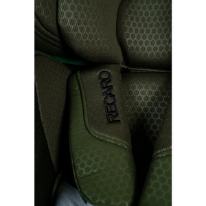 Close-up of Epic Green harness padding with embroidered Recaro logo and honeycomb-patterned fabric.
