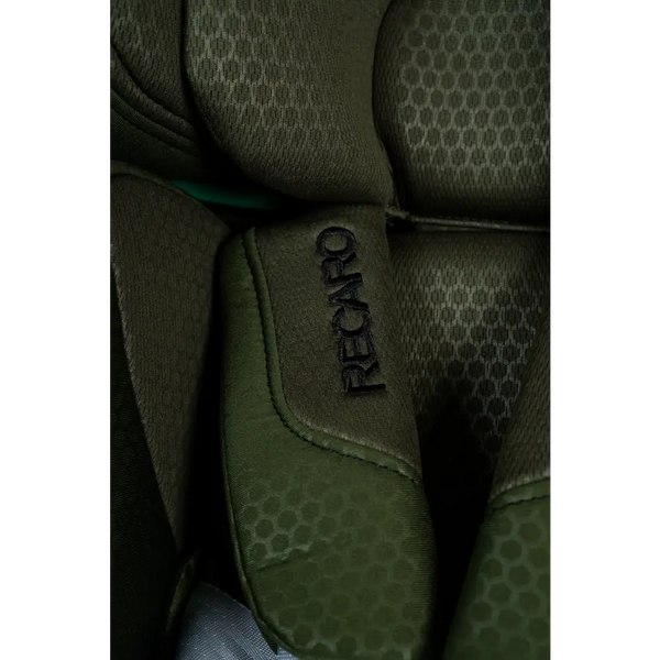 Close-up of Epic Green harness padding with embroidered Recaro logo and honeycomb-patterned fabric.